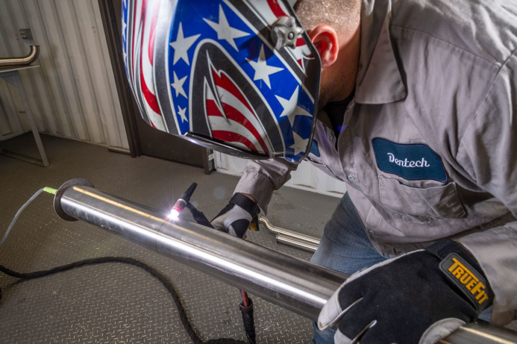 Welder welding a pipe