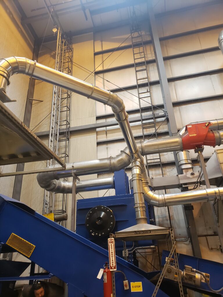 Donaldson Downflow Evolution dust collection system with examples of explosion protection methods: a flameless vent on the dust collector and an isolation valve on the ducting