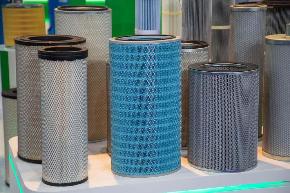Dust collector filters of various sizes and colors on a table