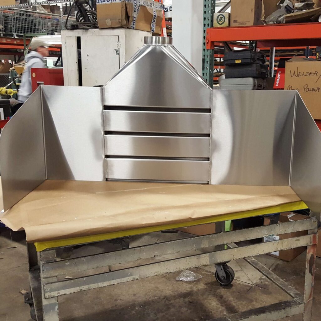 Slotted hood on a work table