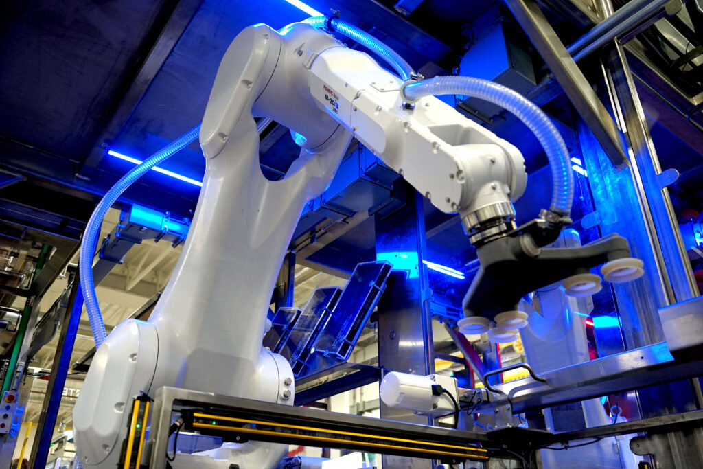 A robot arm working on a food manufacturing process