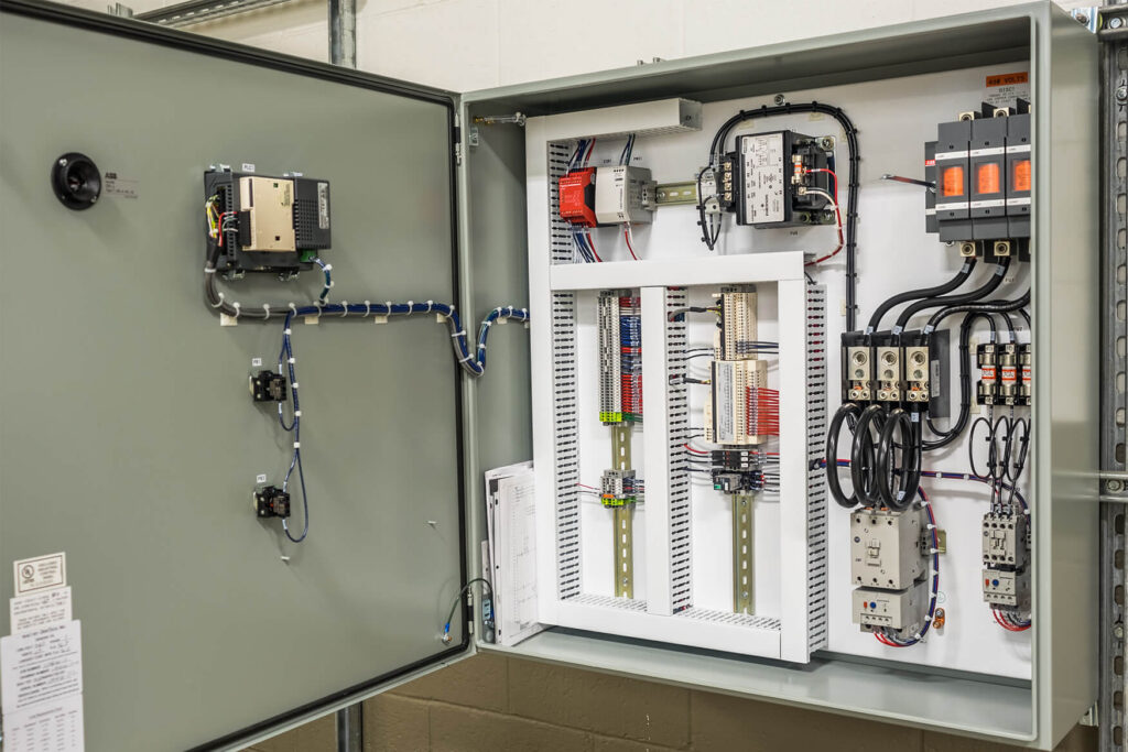 Automated control panel open, showing the wiring inside