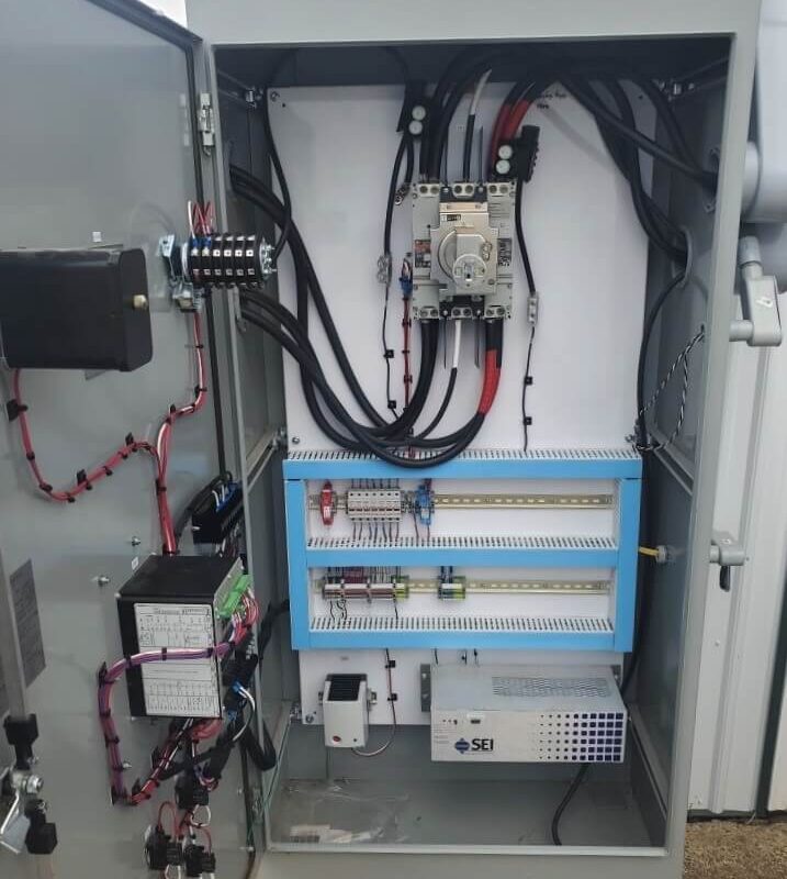Open automated control panel showing the wiring inside